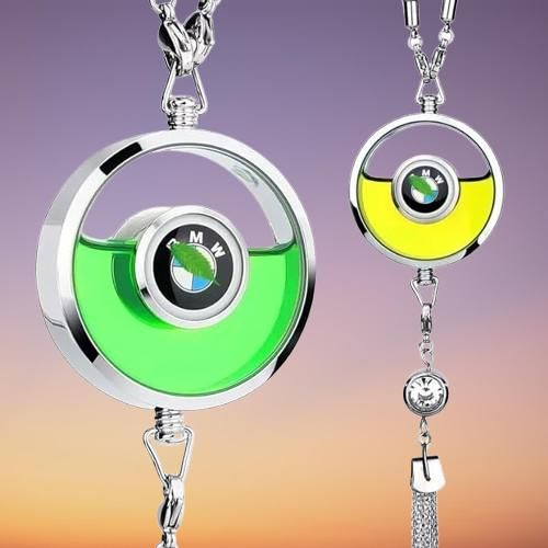 Livingdot auto air freshener pendant with green and yellow liquid in circular chrome frame