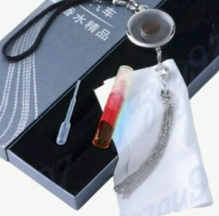 Livingdot auto air freshener pendant with red scent vial and silver tassel in gift box