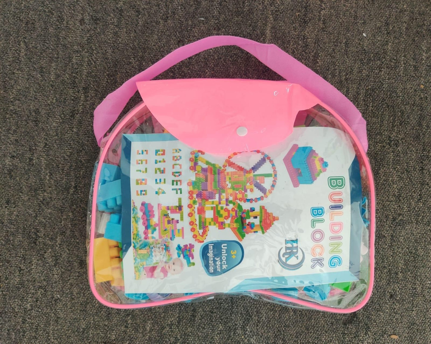 Livingdot children's building block set in a clear pink carrying case with colorful blocks inside