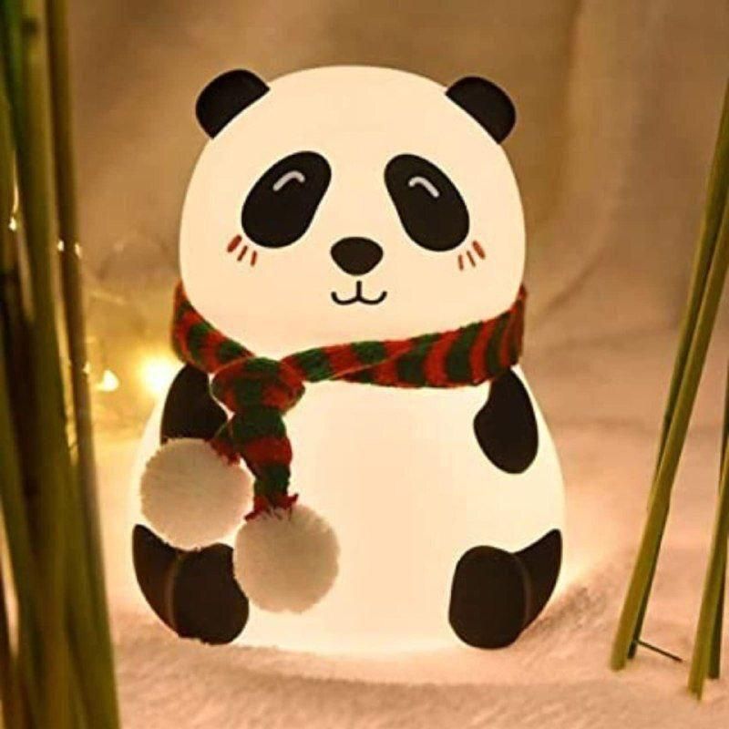 Cute panda night light with a red and green scarf glowing softly in a cozy setting