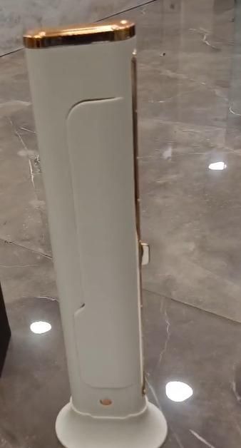 Livingdot desktop USB AC fan in white with gold trim standing on marble floor