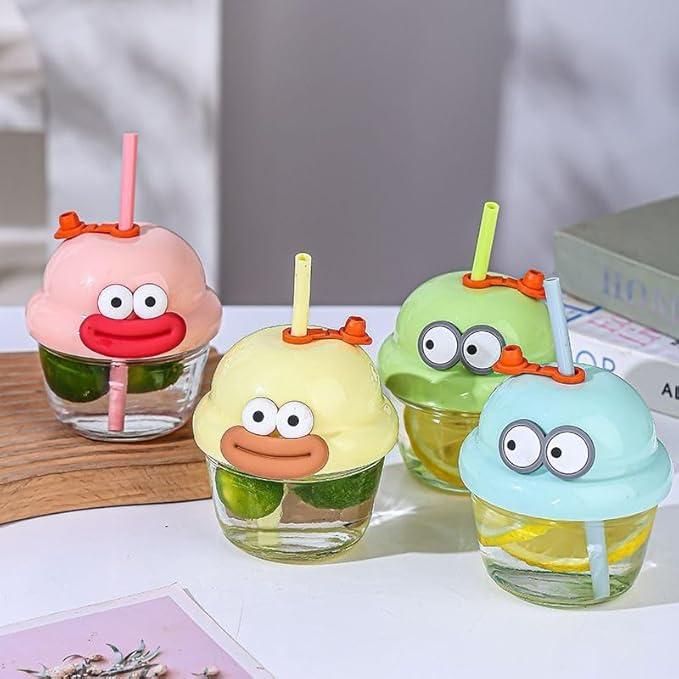 Funny glass cups for children with colorful cartoon face lids and straws, perfect for kids' drinks