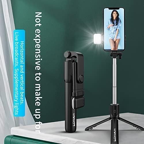 Livingdot portable selfie stick for travel with built-in light and tripod stand holding smartphone