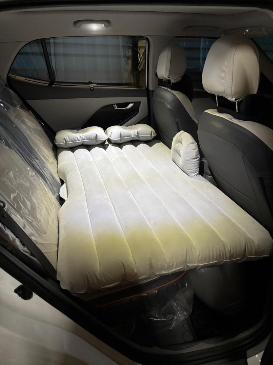 Livingdot portable car travel bed inflated in the backseat for comfortable rest during trips