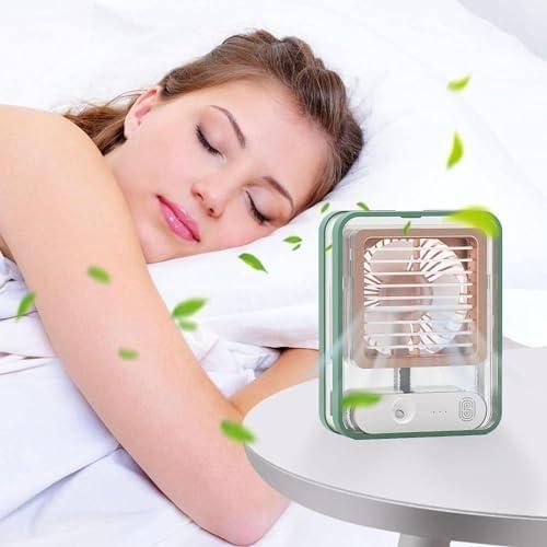 Livingdot portable rechargeable misting fan on a bedside table providing cool air to a sleeping woman