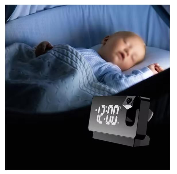 Livingdot black digital projector alarm clock for bedroom showing time 12:00 next to sleeping baby
