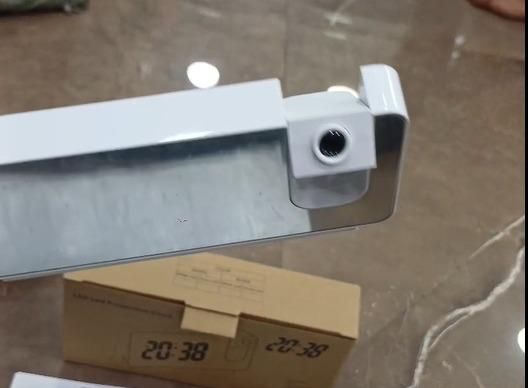 Livingdot projector alarm clock for bedroom showing white adjustable projector arm and packaging box