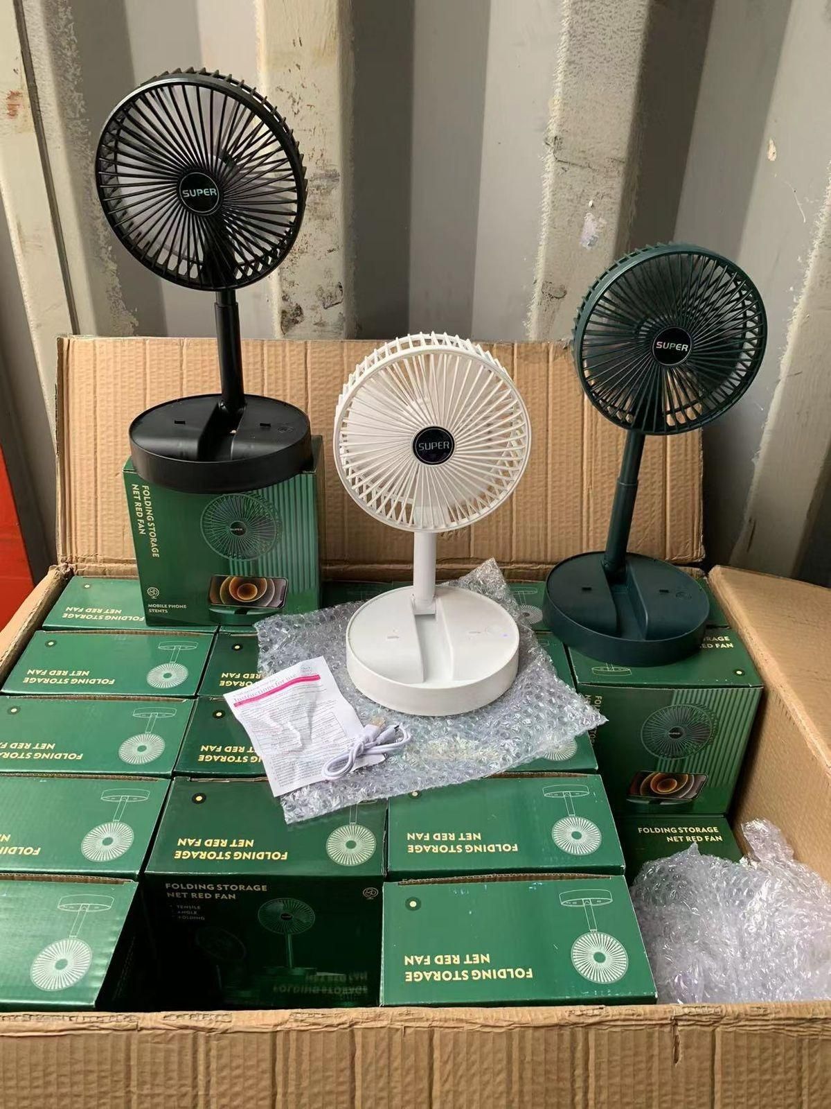 Livingdot rechargeable portable desk fan in black white and green colors displayed on packaging boxes