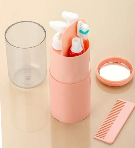 Livingdot travel size personal care kit in pink with toothbrush, toothpaste, mirror, and comb