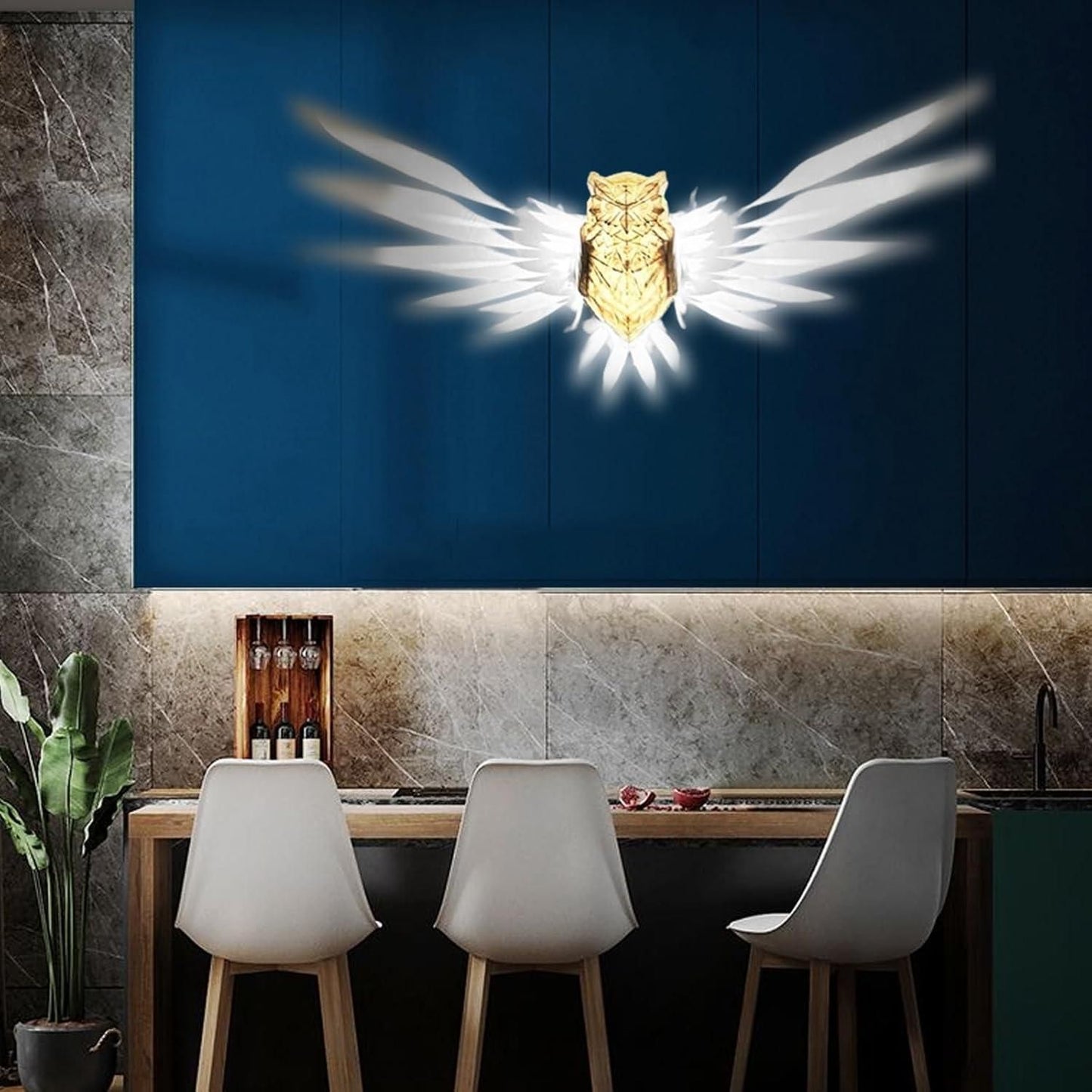 Livingdot unique owl wall light glowing with wings illuminated on blue wall above kitchen counter with chairs