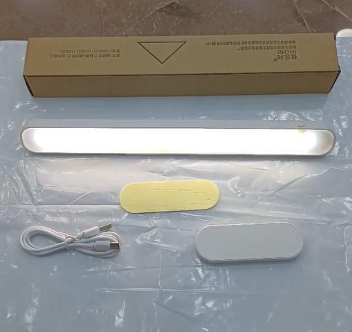 Livingdot USB rechargeable LED light with USB cable, adhesive pads, and packaging box