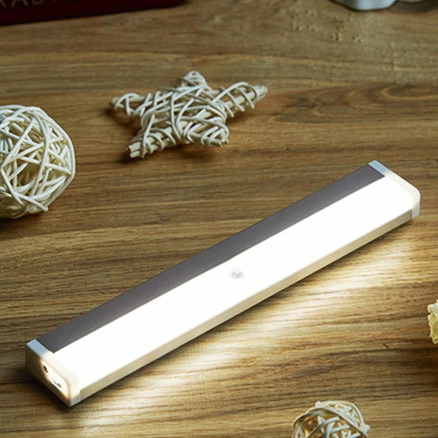 Livingdot USB rechargeable LED light bar glowing on wooden surface with decorative wicker stars