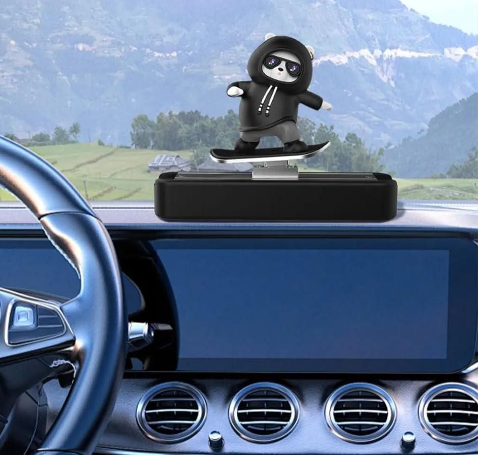 Livingdot cute car dash accessory featuring a skateboarder figurine in black hoodie on car dashboard