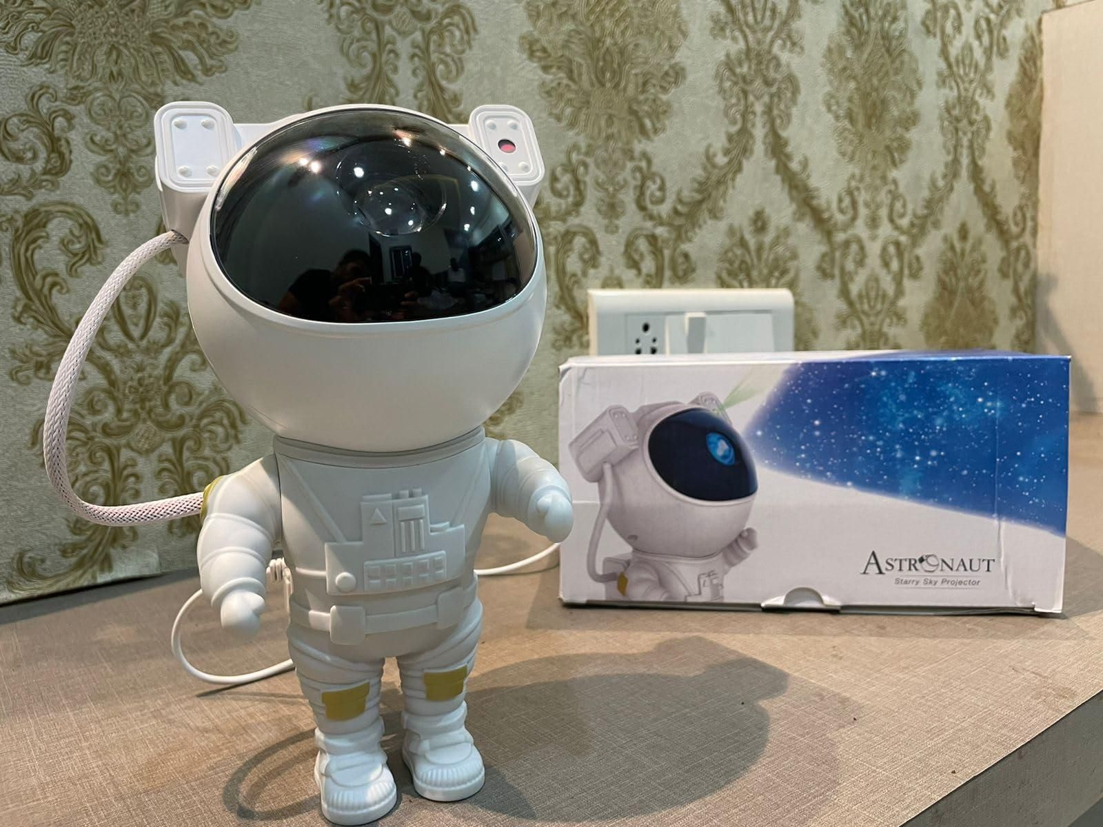 Livingdot astronaut galaxy projector in white astronaut design with black helmet and starry light projection box