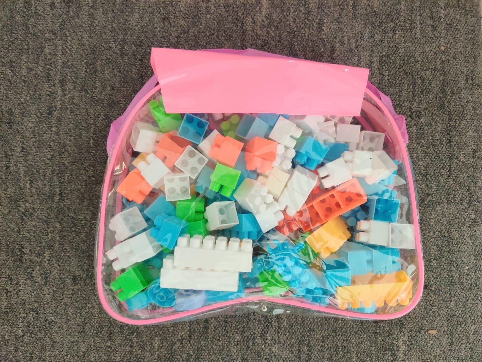 Livingdot children's building block set with colorful plastic bricks in a clear pink storage bag