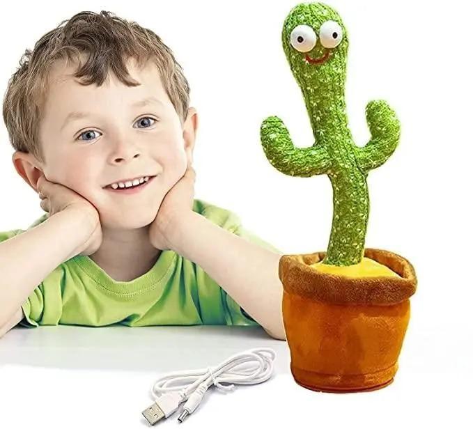 LED cactus toy with smiling face and USB cable next to happy young boy in green shirt